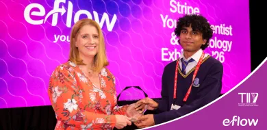 The image shows a woman presenting an award to a school student at Stripe Young Scientist and Technology Exhibition. There are eFlow and TII logos on the bottom right corner.
